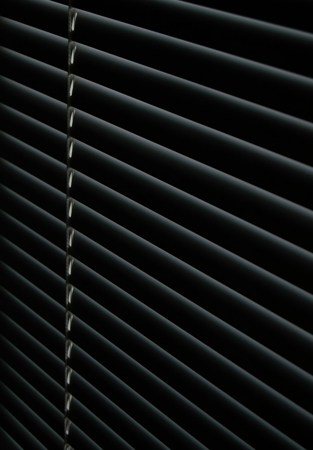 a-close-up-of-a-black-surface-shgur32ifnq